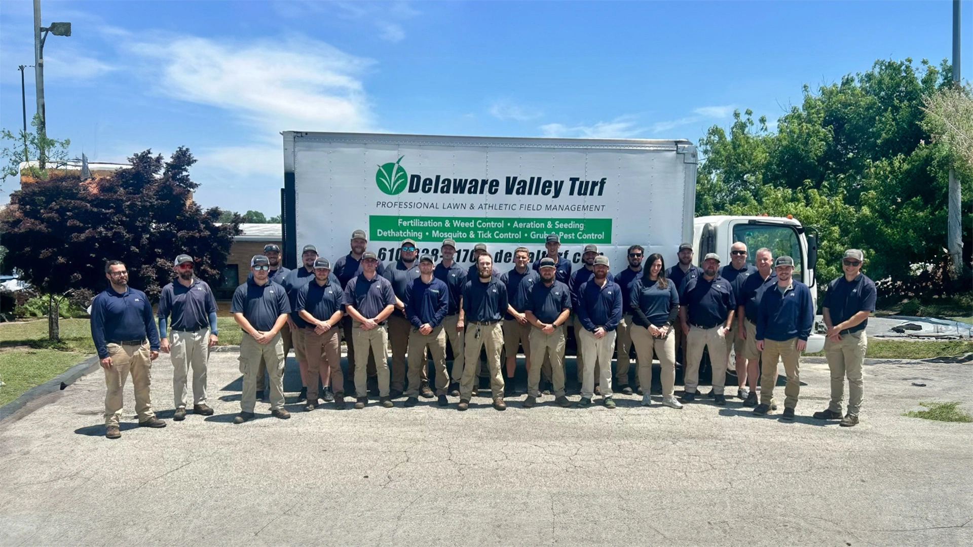 Delaware Valley Turf team in front of truck.
