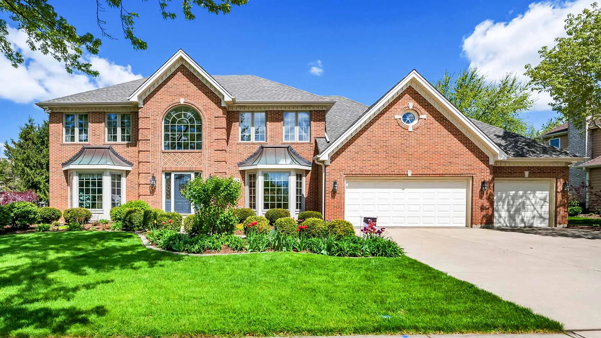 A lovely home on a sunny day with clouds in the sky near Wilmington, DE.