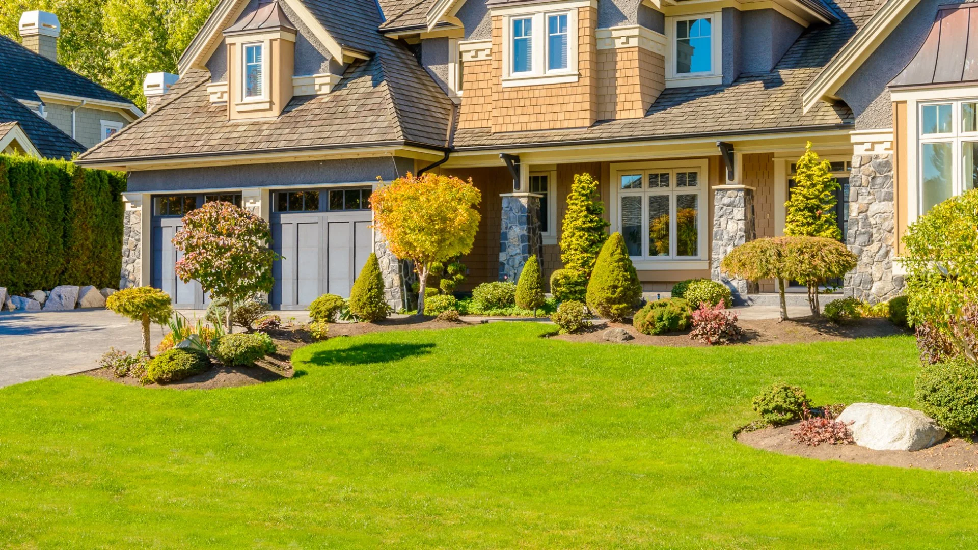 A home with beautiful green lawn and landscaping due to our services in Kennett Square, PA.