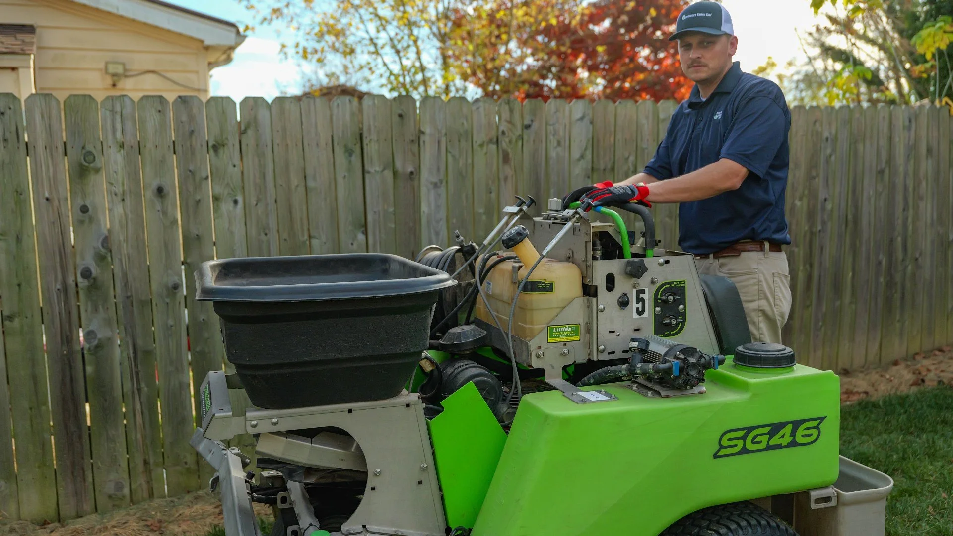 Lawn care professional operating a treatment machine in Doylestown, PA.