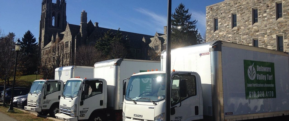 The Delaware Valley Turf work trucks parked at a job.