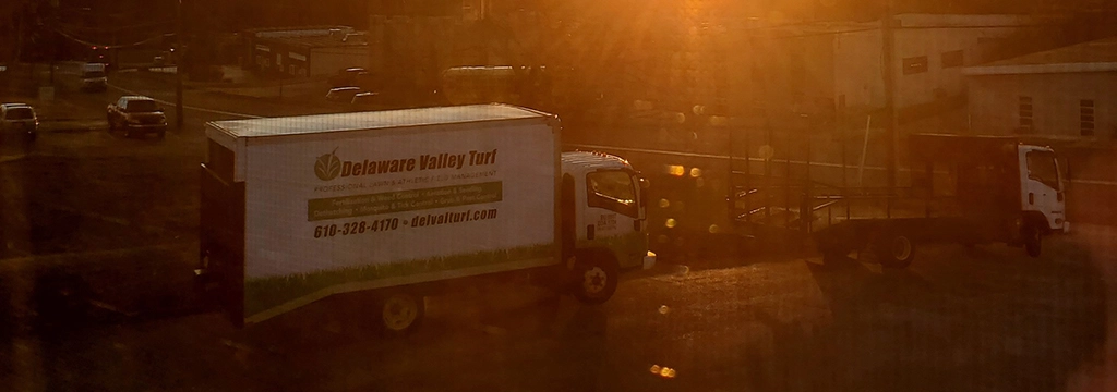 Work trucks on street.